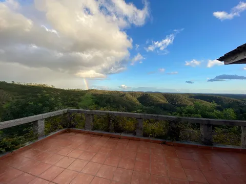 A rainbow over the hills, seen from the house's terrace